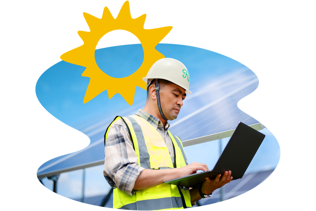 Worker in a hard hat and safety vest uses a laptop near solar panels, with a sun graphic in the background.